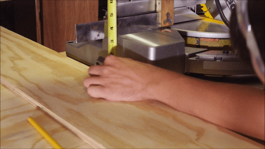  measure the height of the miter saw bed