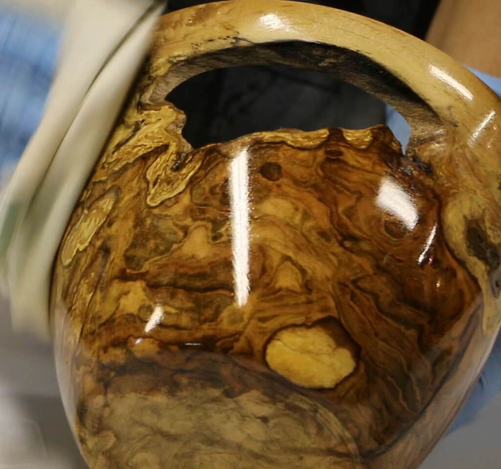 turning a green burl wooden bowl
