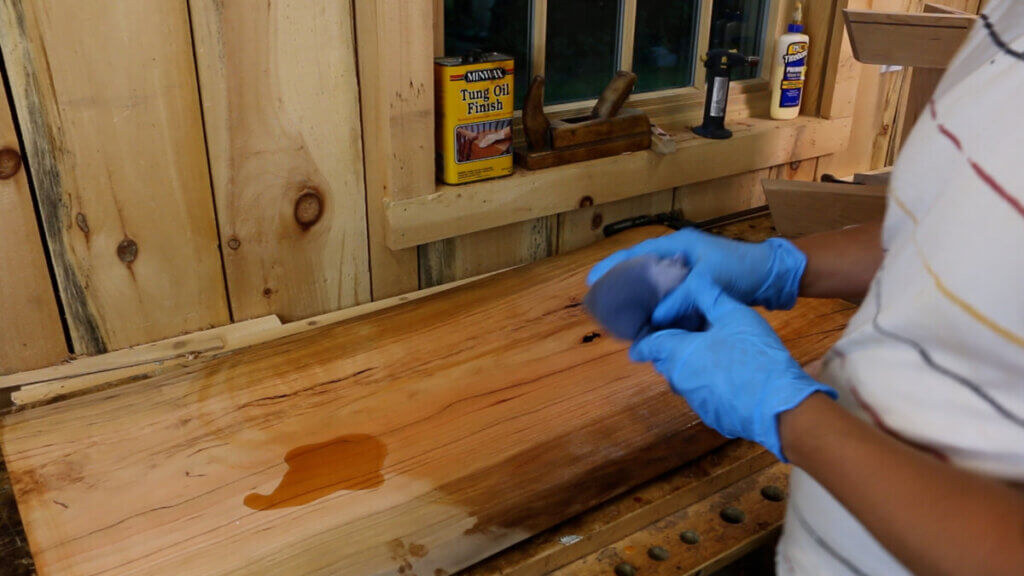 Apply tung oil with a cloth.